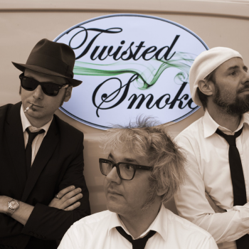Twisted Smoke Band in front of truck with their logo