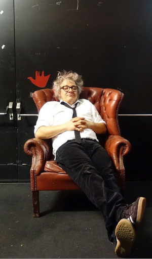 Michele Limina sitting in an armchair